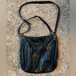 Black and gold Michael Kors purse.